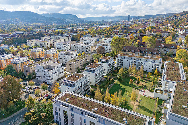 Luftaufnahme des Wohnquartiers Nordlichter in Jena-Nord mit modernen Mehrfamilienhäusern, begrünten Dächern und großzügigen Grünflächen.